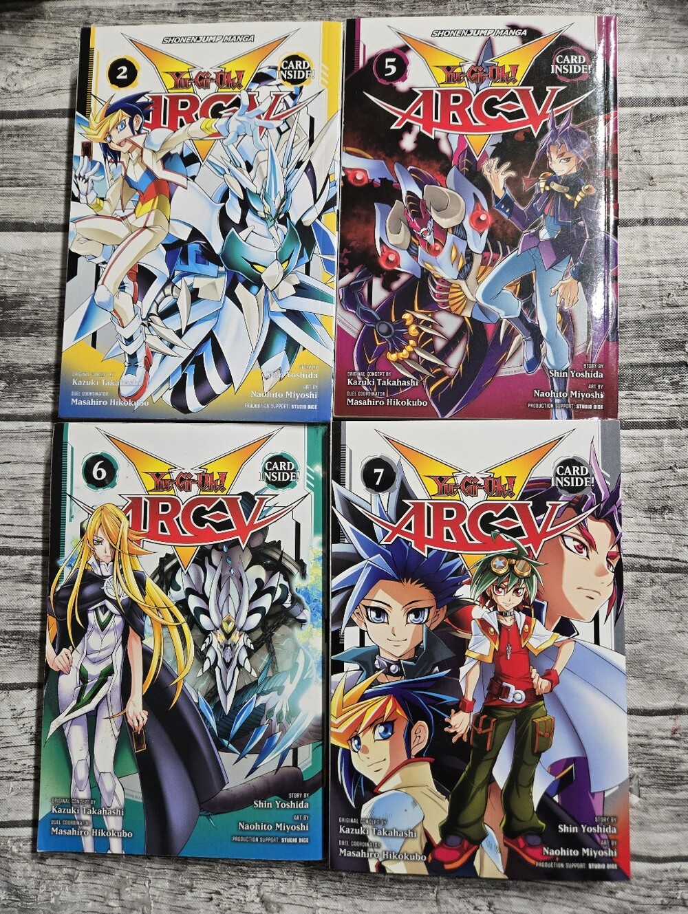 Volumes 2, 5, 6 & 7 of the Yu-Gi-Oh! Arc-V manga series published by Viz featuri